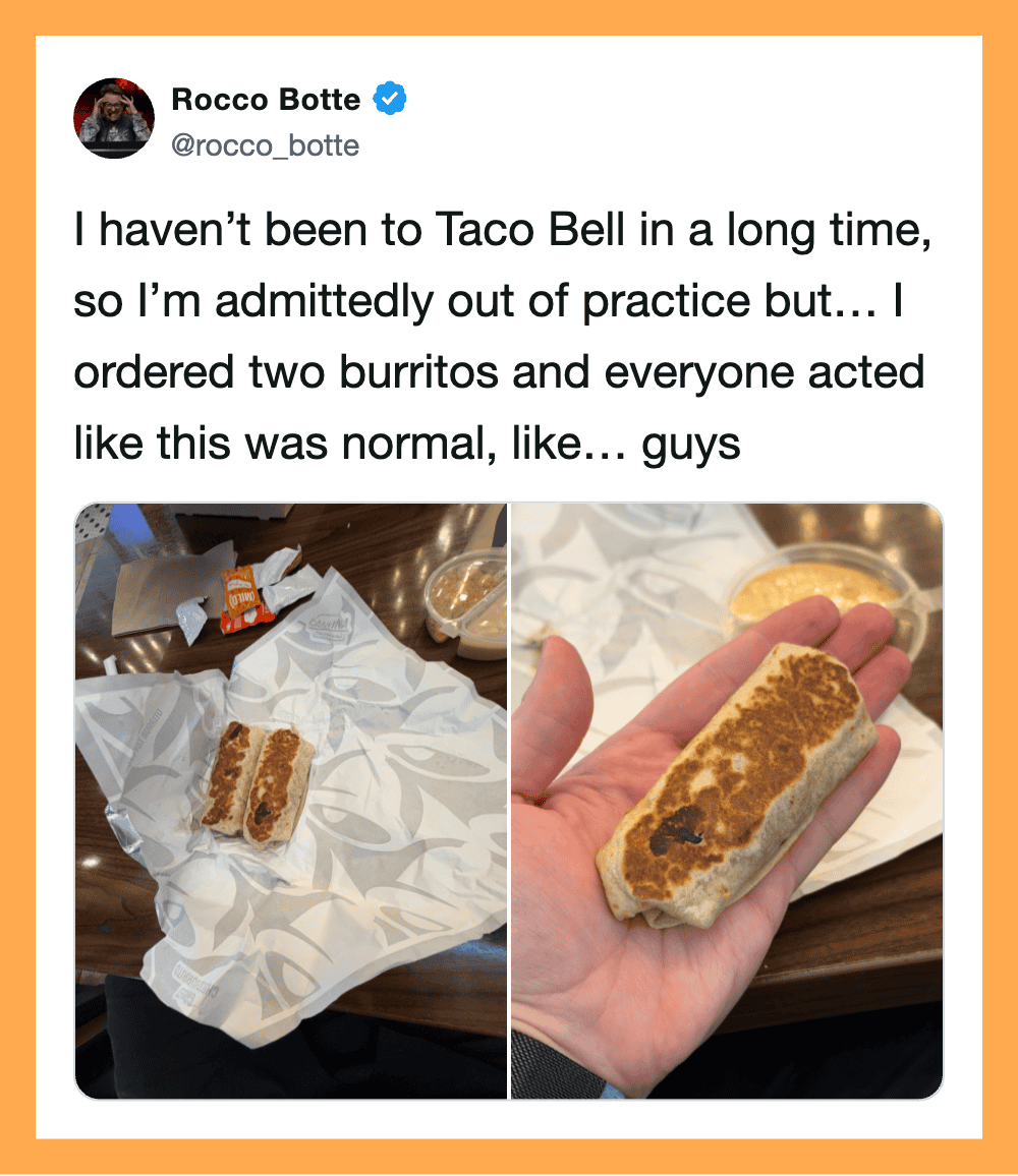 Two burritos on Taco Bell napkins, one on a table and one in hand.