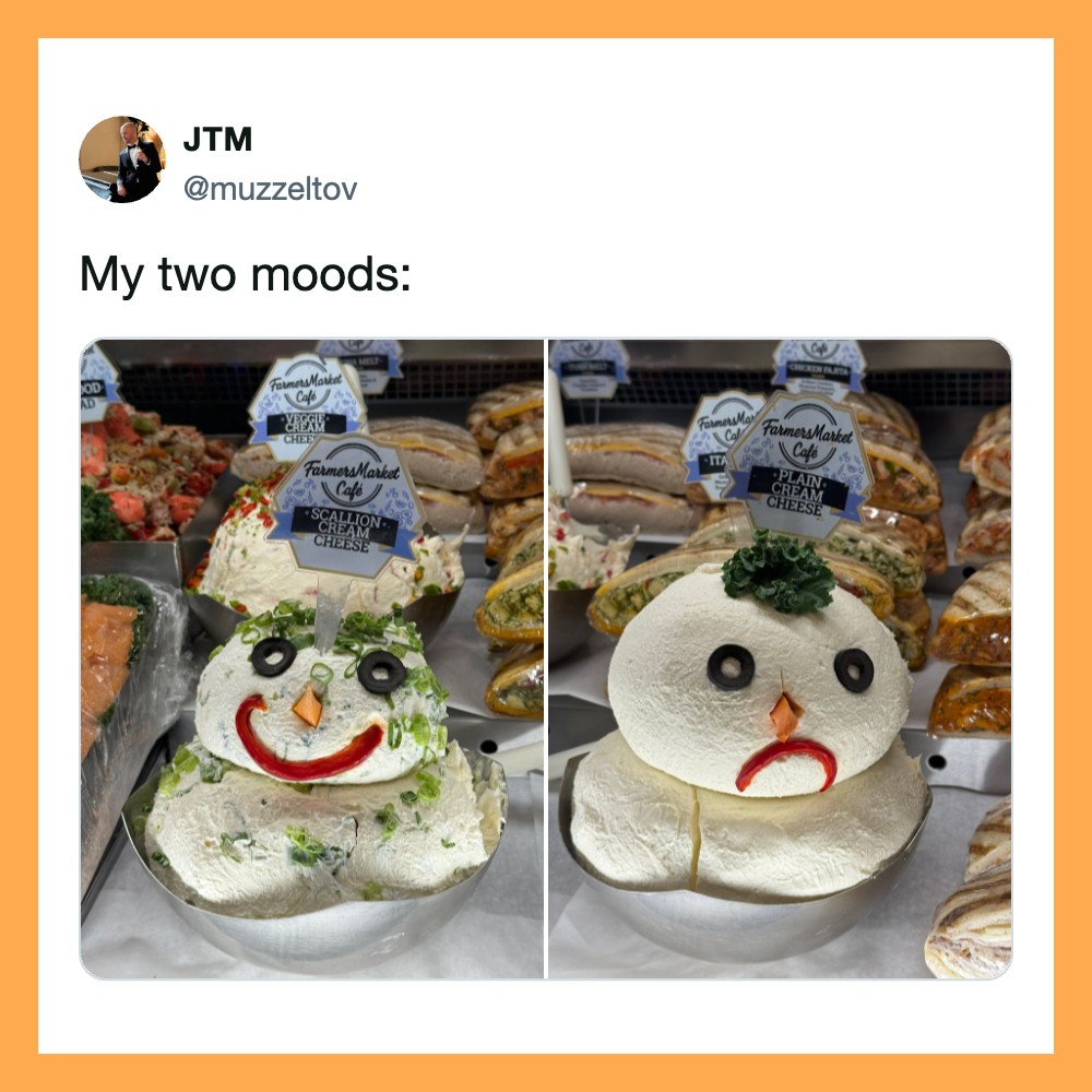 Two snowman cakes with different expressions in a bakery display.