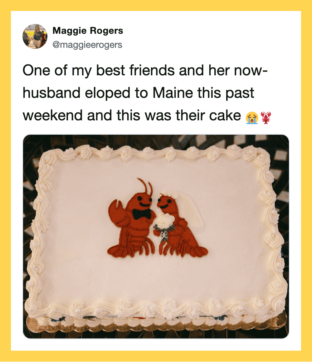 Cake with lobster and crab decorations, celebrating a wedding in Maine.