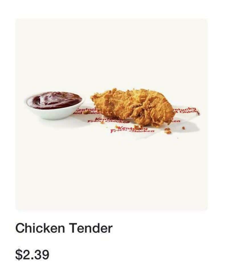Fried chicken tender with a side of dipping sauce on a white background.