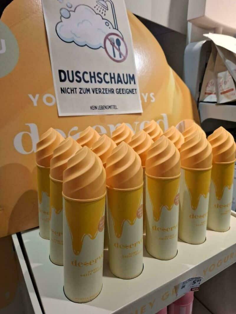 Sign says 'DUSCHSHAUM NOT FOR DRINKING' with a crossed-out glass icon.