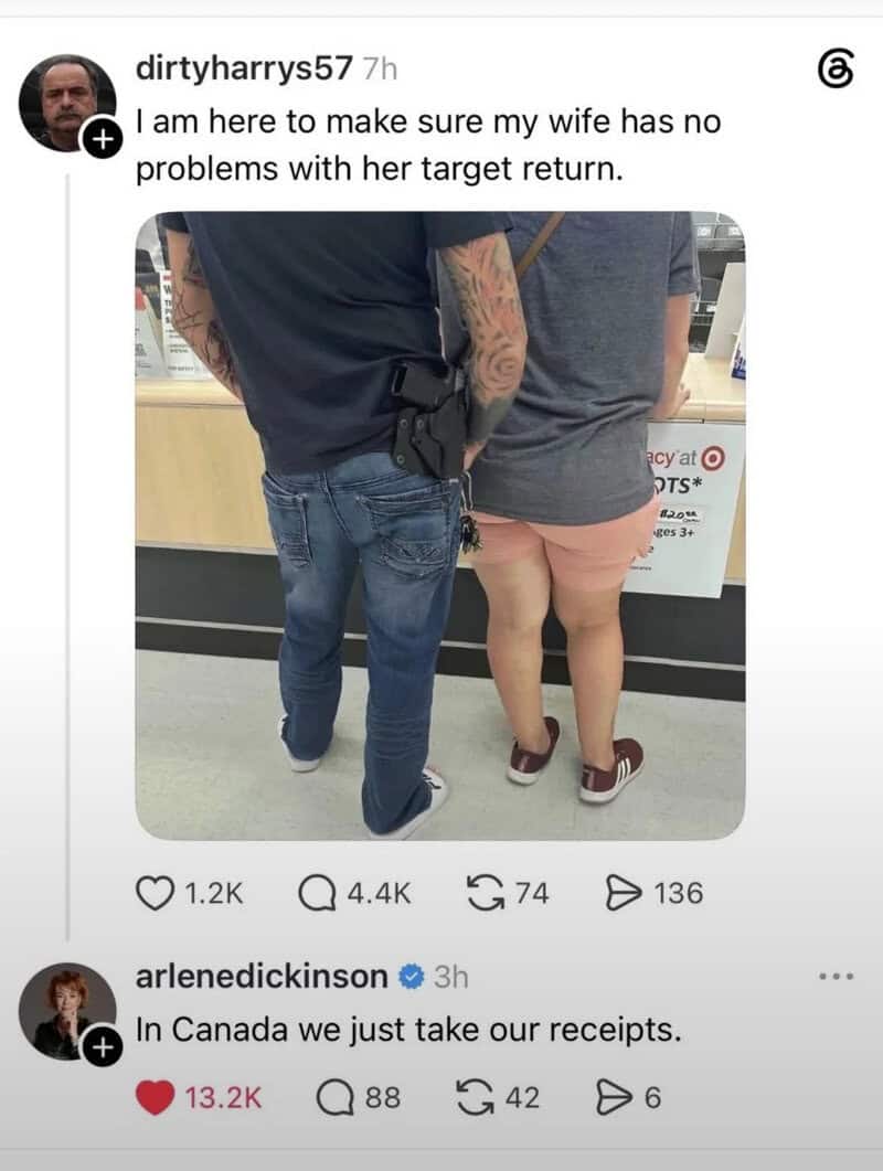 Photo of a man and woman at a checkout counter, man with tattoos and a gun in his waistband.