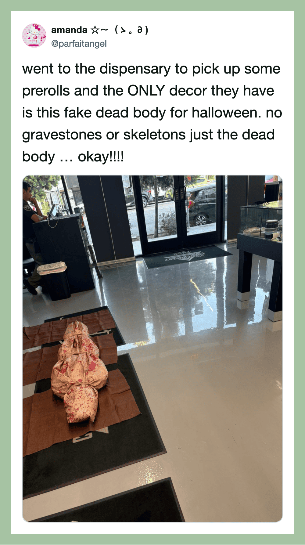 Fake dead body with prerrols at a dispensary for Halloween decor.