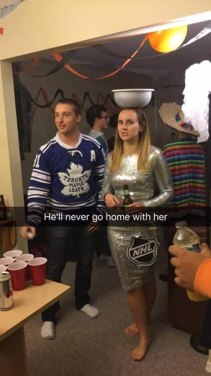 Two people at a party with streamers; man in Toronto Maple Leafs jersey, woman in silver dress, a NS.