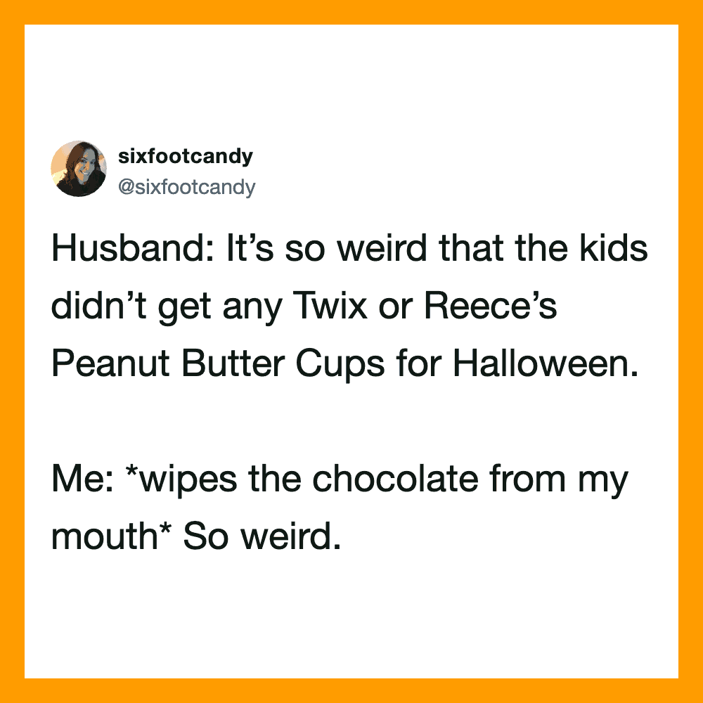 Husband and wife discussing Halloween candy, wife wiping chocolate from her mouth.