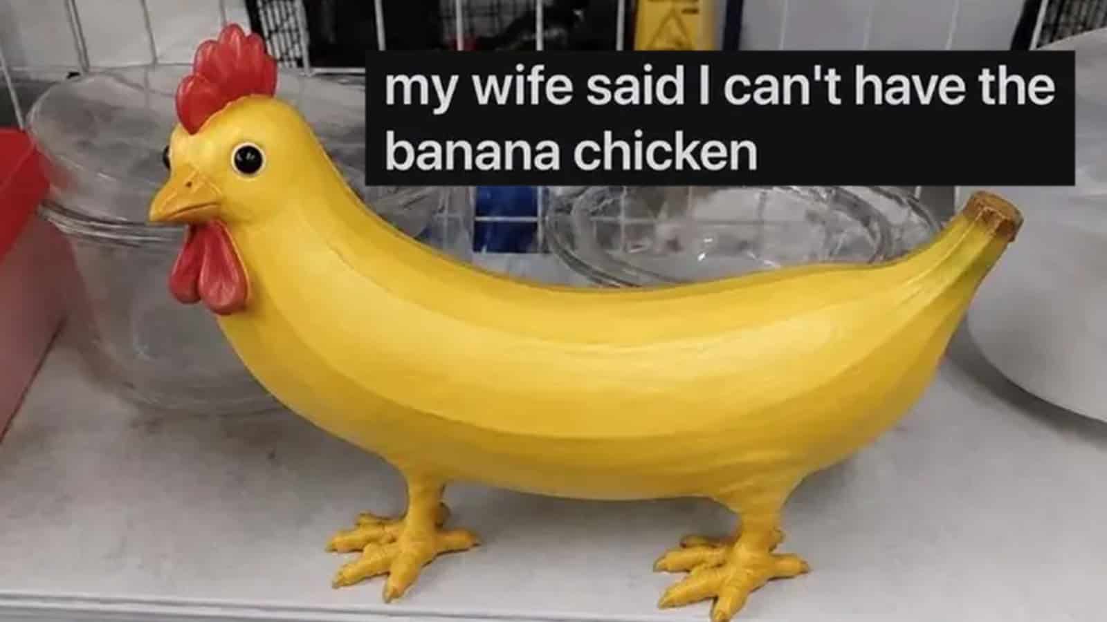 A chicken-shaped banana holder with a banana as the body and a chicken head on one end.