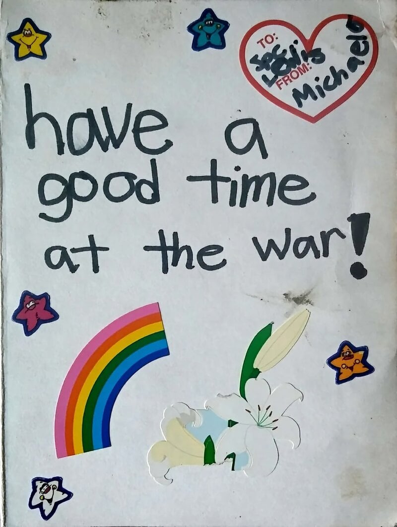 Have a good time at the war! note: rainbow, flowers, and stars drawn around the message.