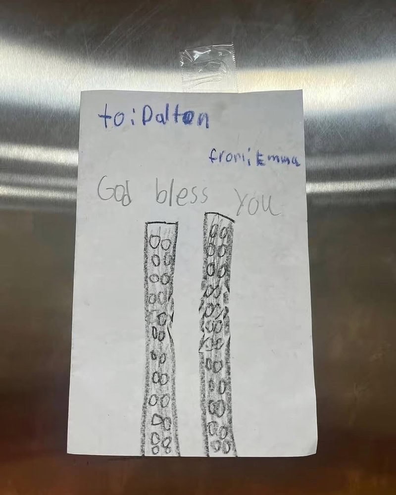 Palten from: mom God bless you (two tall buildings with windows).