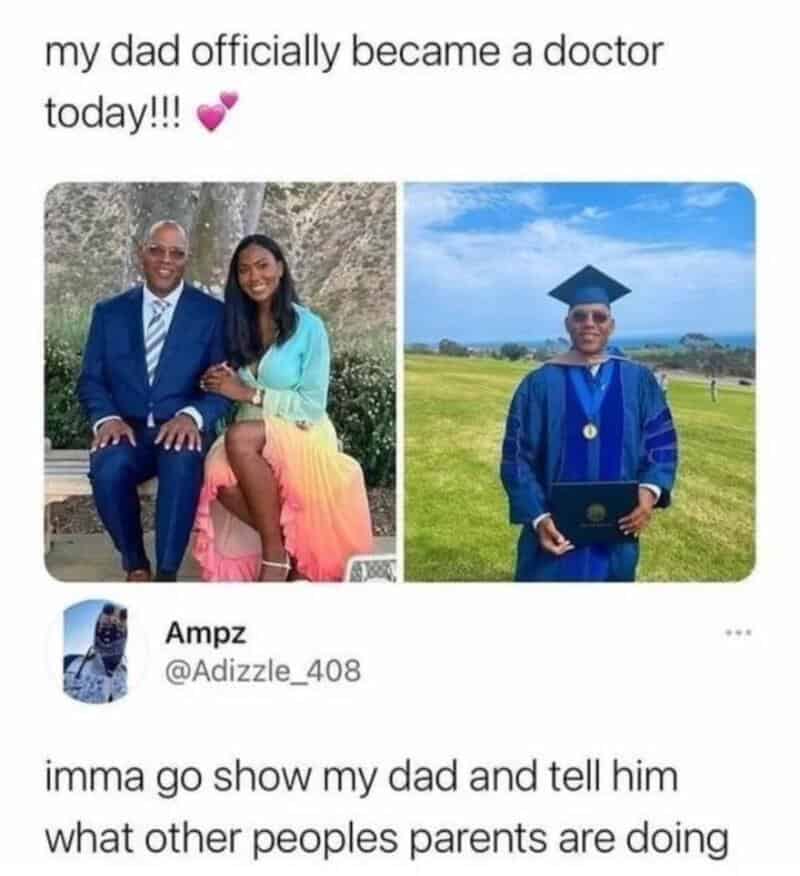 Father and daughter in graduation attire, father in a suit, daughter in cap and gown.