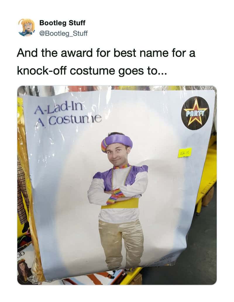 Man in purple and white costume with crossed arms, on a store display.