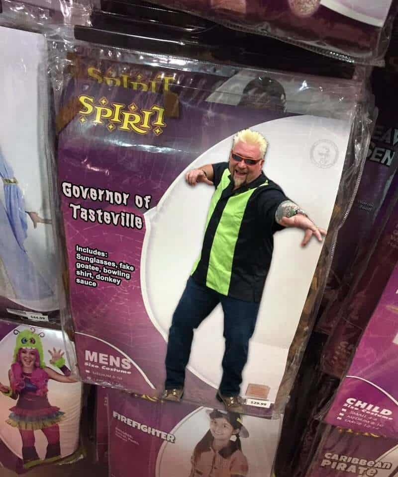 Costume of the Governor of Tasterville with sunglasses, green vest, and tattooed arm.