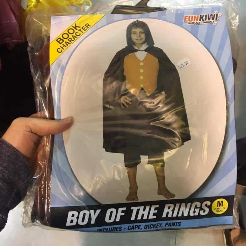 Boy of the Rings costume with cape, dickey, and pants in packaging.