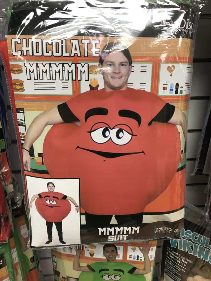 Person wearing a Mr. Potato Head costume with a smiling face and black eyebrows.