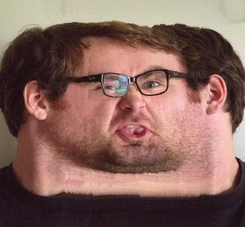 Humorous photo of a man with a distorted face and glasses.