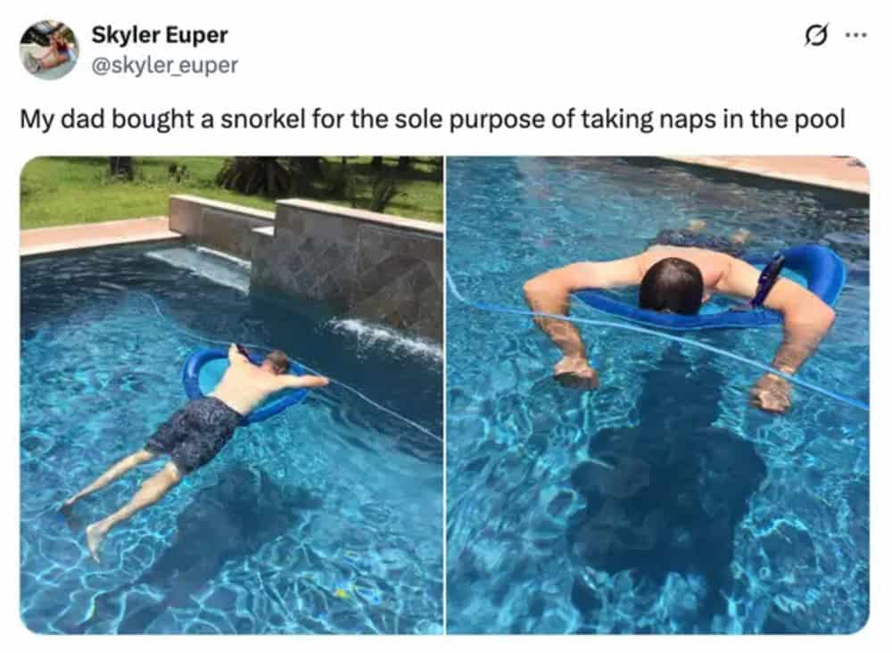 Child using a snorkel to take a nap in the pool, with a parent nearby.
