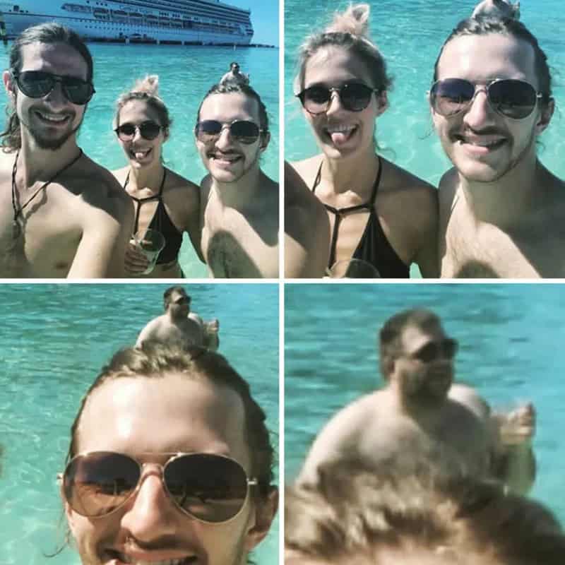 Group of friends enjoying a day at the beach, taking selfies in the water.