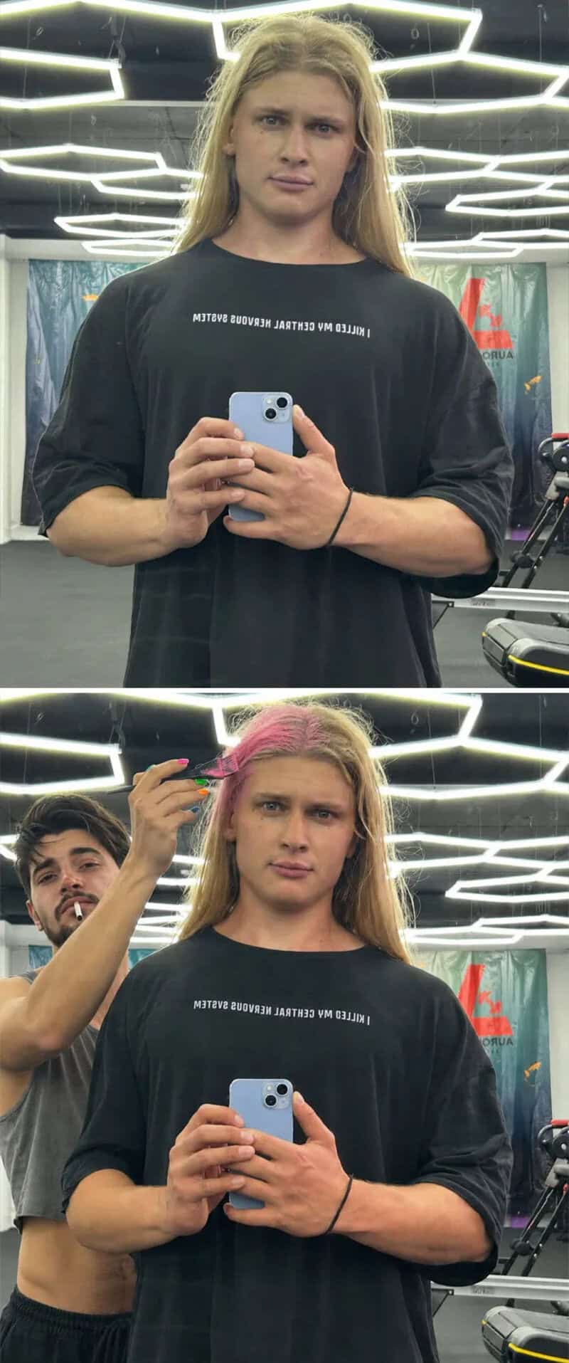 A young woman with blonde hair taking a mirror selfie in a gym.