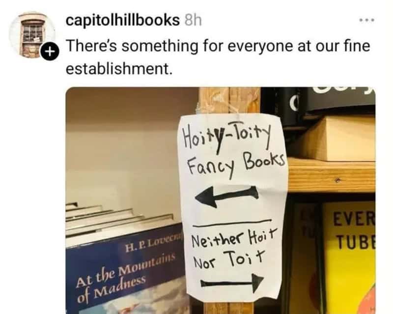 Sign pointing to 'Haughty-Toity Fancy Books' and 'Neither Haughty Nor Tooty'.