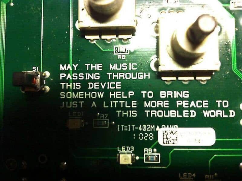 Circuit board with message: 'May the music passing through this device somehow help to bring just a,.