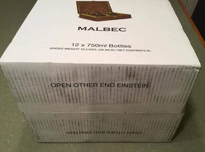 Box of Malbec wine with humorous message: 'Open other end Einstein'.