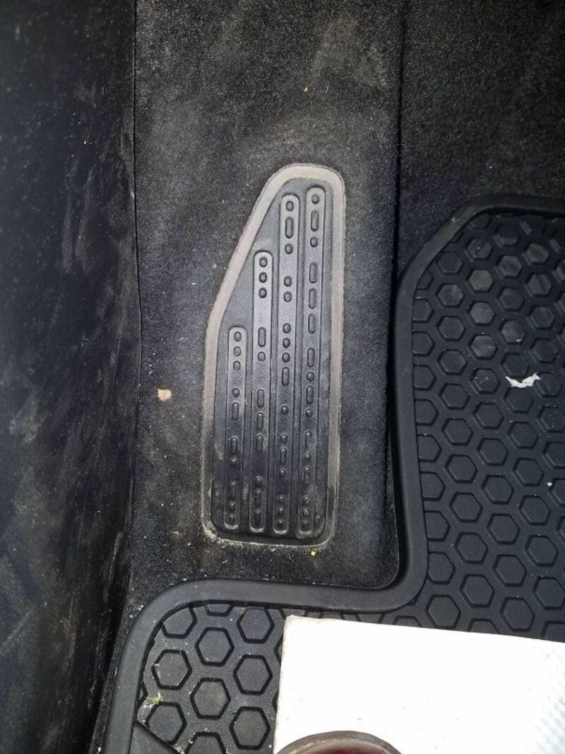 Car pedal with a hidden message reading 'Honk if you're horny'.