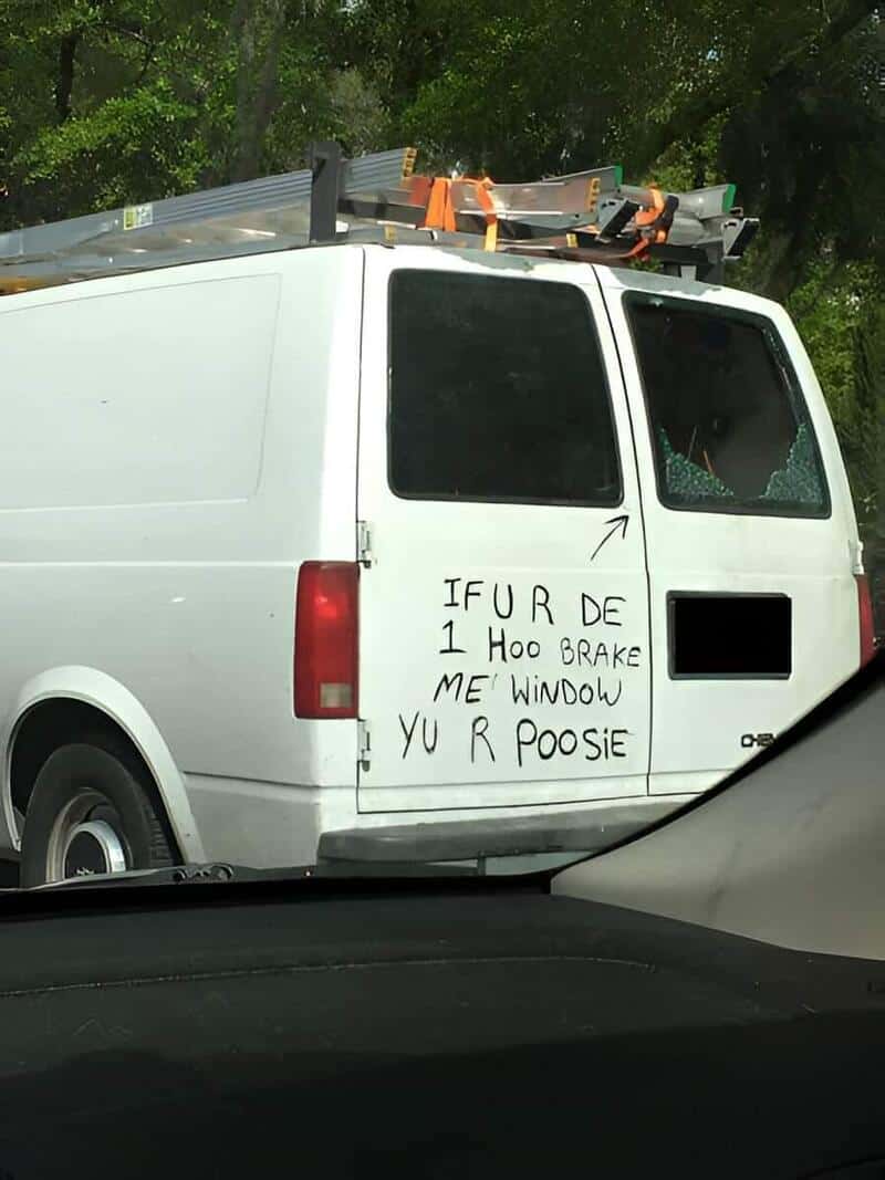 White cargo van with broken rear window and handwritten graffiti on side reading: IFURDE 1 Hoo Brake.