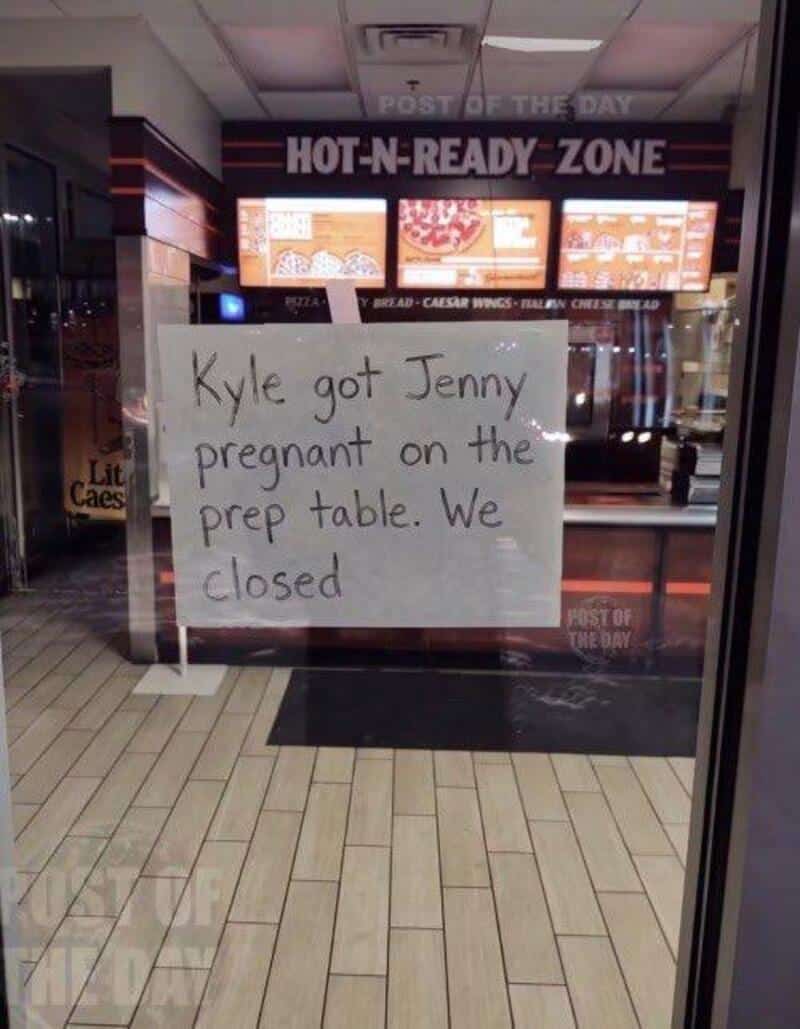 Sign on restaurant window reads: 'Kyle got Jenny pregnant on the prep table. We closed' with visible.