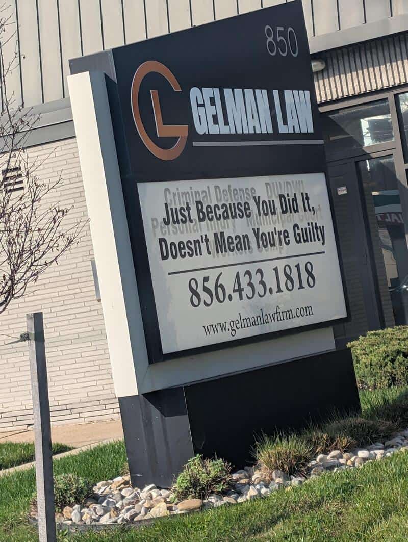 Gelman Law sign with slogan: Just Because You Did It Doesn't Mean You're Guilty, 856.433.1818.