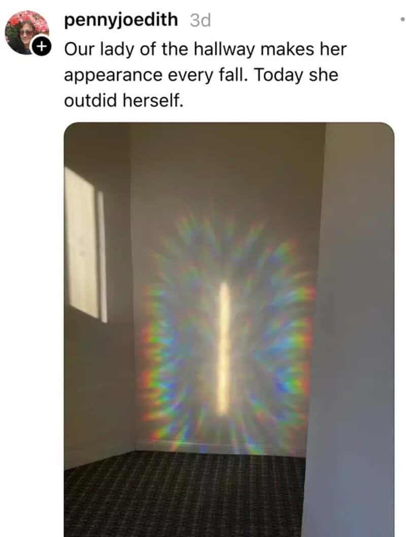 Rainbow light pattern on the hallway wall with sunlight and shadow.
