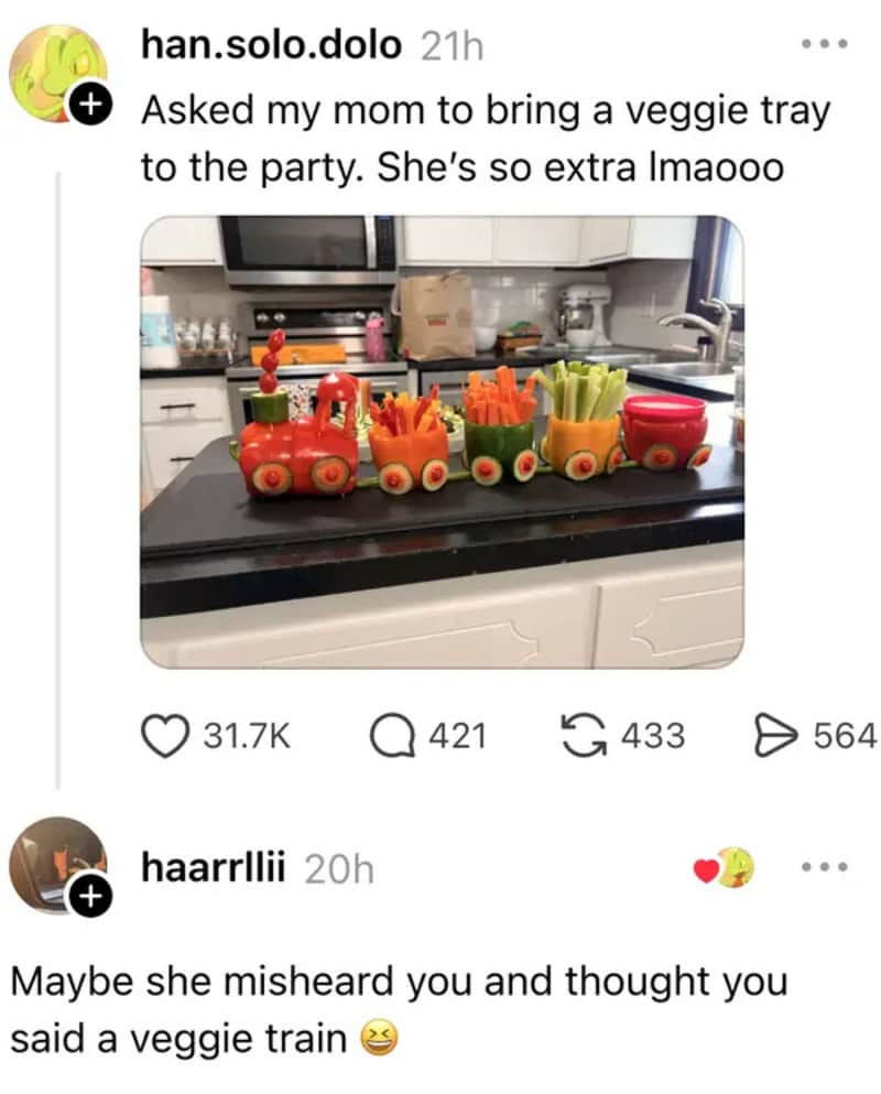 Colorful veggie train made from vegetables and a toy train on a kitchen counter.