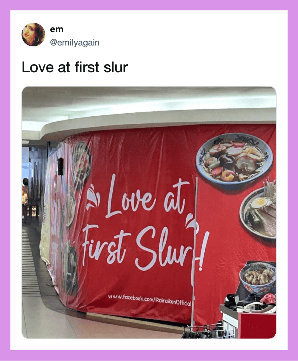 Love at first slur sign on a red background at a food court.