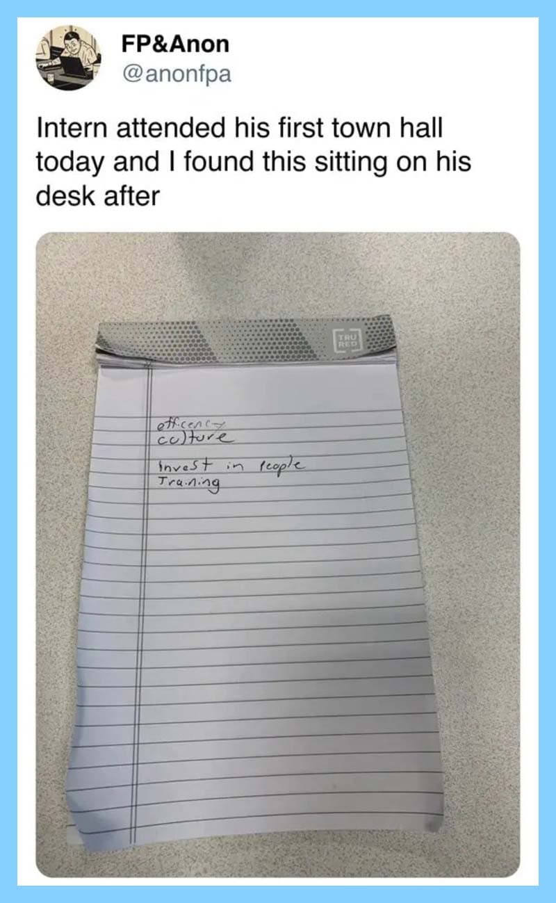 Notepad with handwritten notes on a desk, with a tweet about an intern at a town hall.