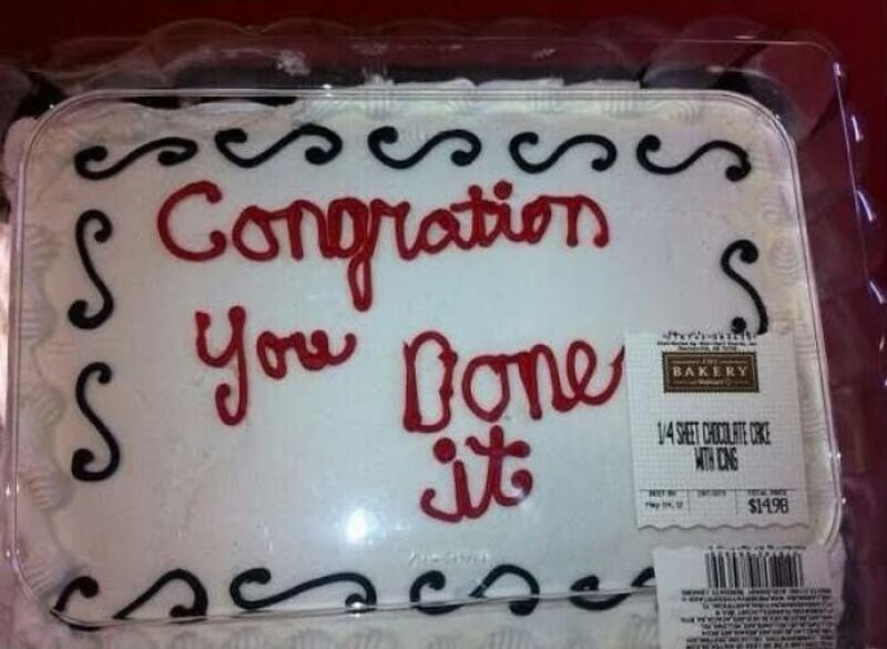 Congratulations You Done it cake with ornate border and bakery label.