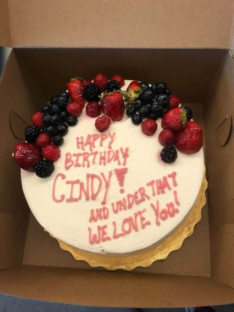 Happy birthday Cindy! And under time we love you. Cake with berries in box.