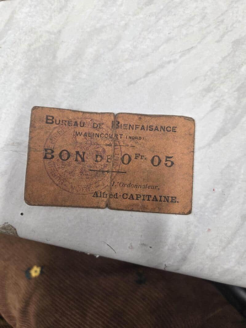 Old French Benevolence Office ticket with text and stamp.