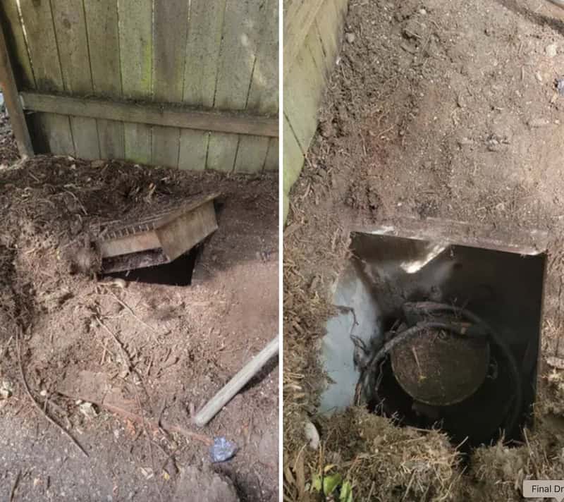 Underground utility access point with a cover removed, showing the opening and interior.