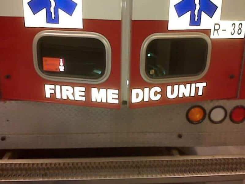 Fire department vehicle with a typo reading 'FIRE ME DIC UNIT'.