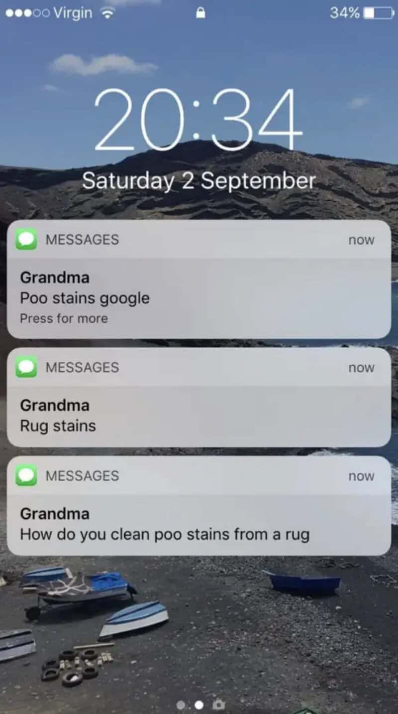 Three notifications from Grandma about poo and rug stains on a phone lock screen.