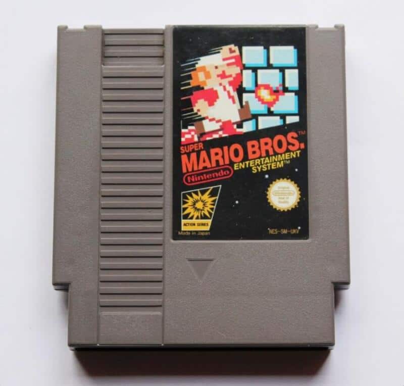 Super Mario Bros. cartridge label for Nintendo Entertainment System (NES) showing Mario jumping and.