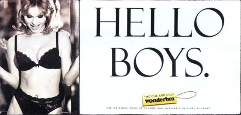 Vintage swimsuit photo with a woman in black lingerie posing beside 'Hello Boys' text.
