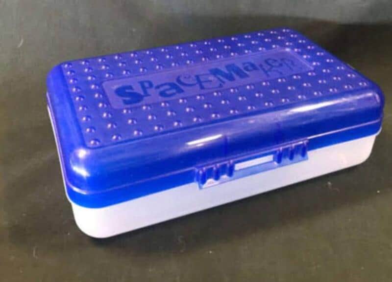 Nostalgic SpaceMan lunchbox blue lid with white base, dotted texture on top, closed.