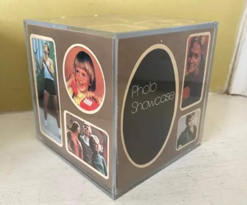 Nostalgic photo showcase cube with vintage pictures and an oval label on the front.
