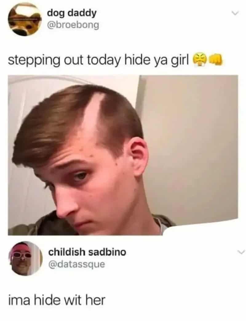 Young man with a shaved side hairstyle looking sideways.