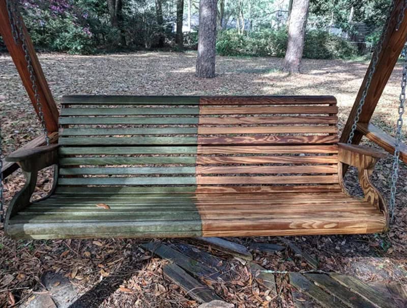 Before and after power washing on a wooden swing bench in a park.