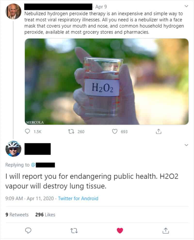 Hand holding a beaker with H2O2, promoting hydrogen peroxide therapy.