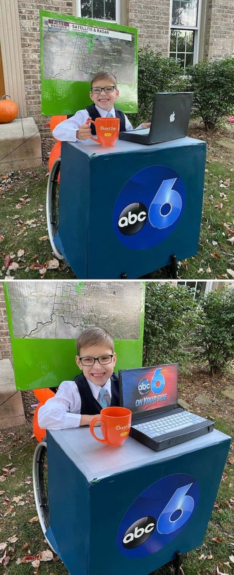 Child in costume at abc6 news booth with laptop and orange mug, wheelbarrow cart, pumpkins nearby.