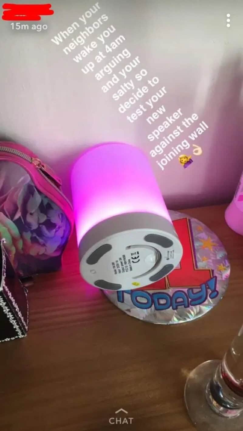 Humorous scene with a pink speaker and a note about petty revenge.