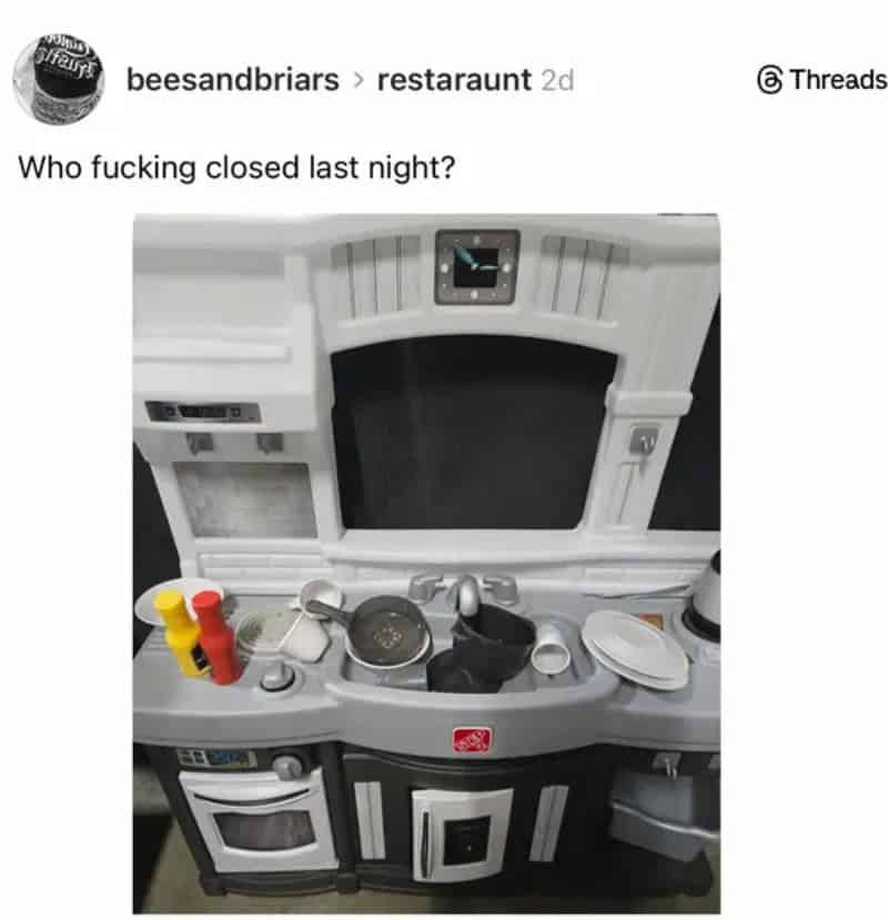 Who fucking closed last night? interior of a pretend kids play kitchen with plastic utensils and toy.