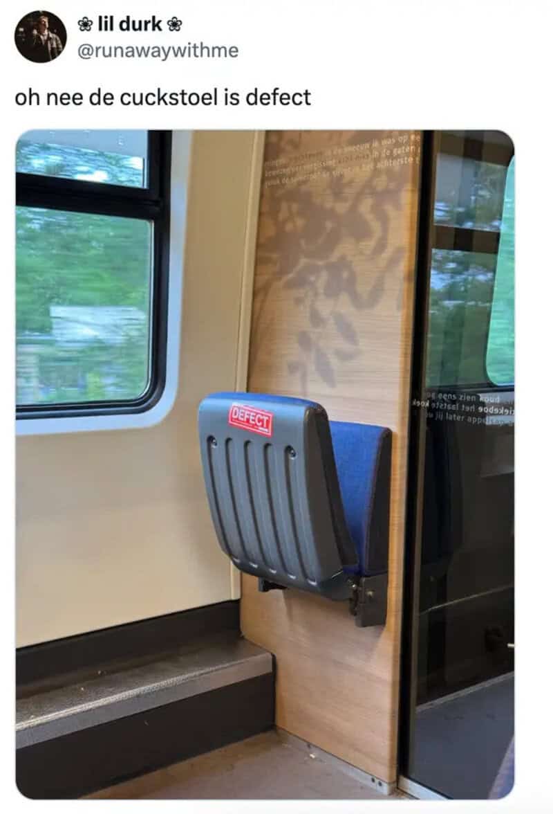 Oh nee de cuckstoel is defect on train seat with red label reading DEFECT on blue backrest.