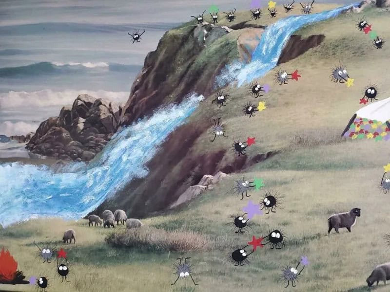Colorful painting of insects, animals, and a waterfall on a hillside.